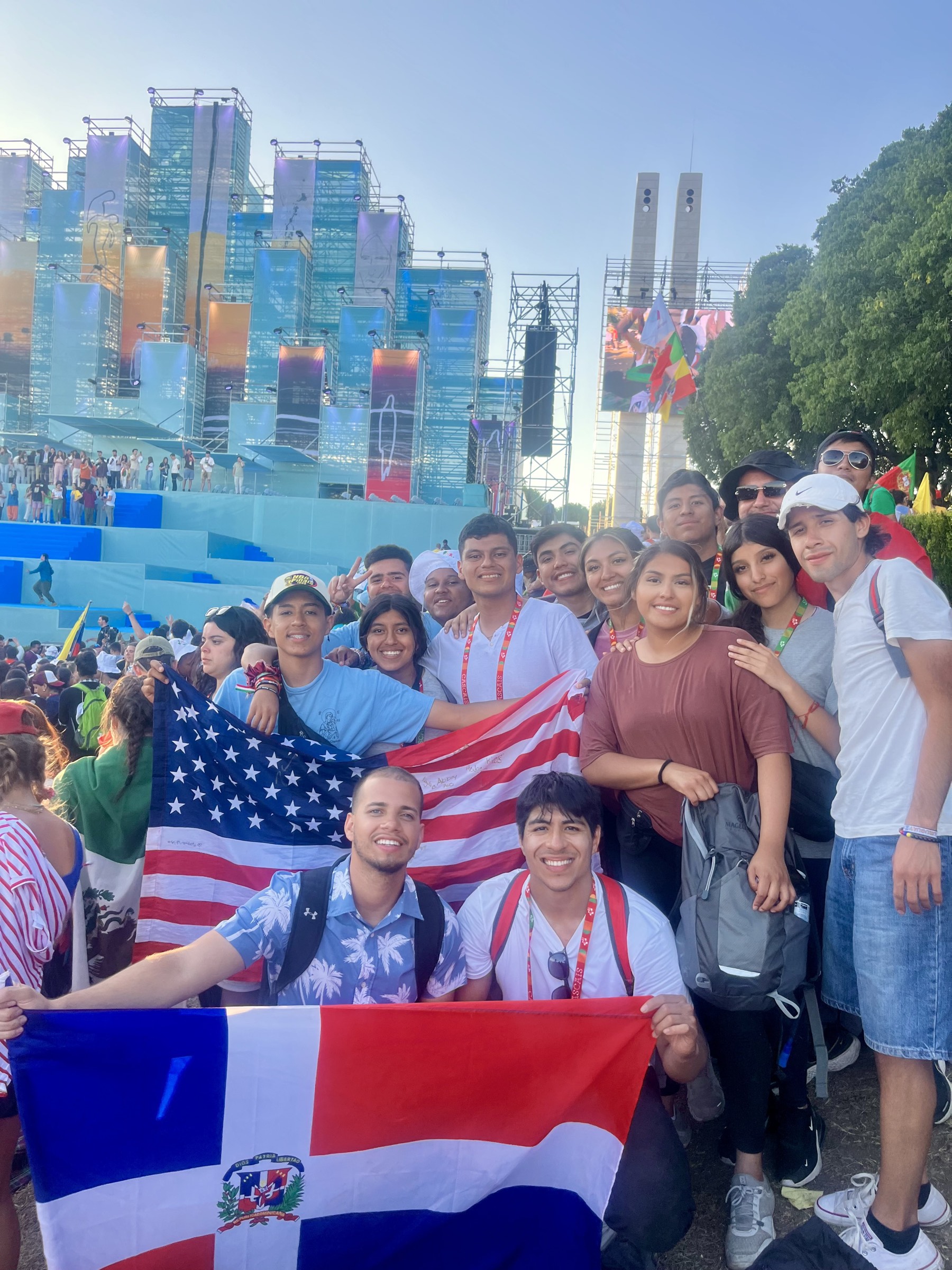 Via Fidelis pilgrims together at World Youth Day, holding the United States and Dominican Republic flags
